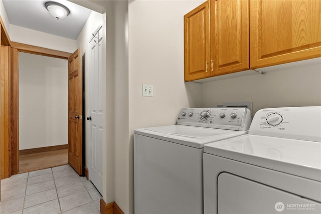 427 Rendezvous Rd, Winthrop, WA 98862 - laundry area with washing machine and dryer, cabinet space, and light tile patterned floors