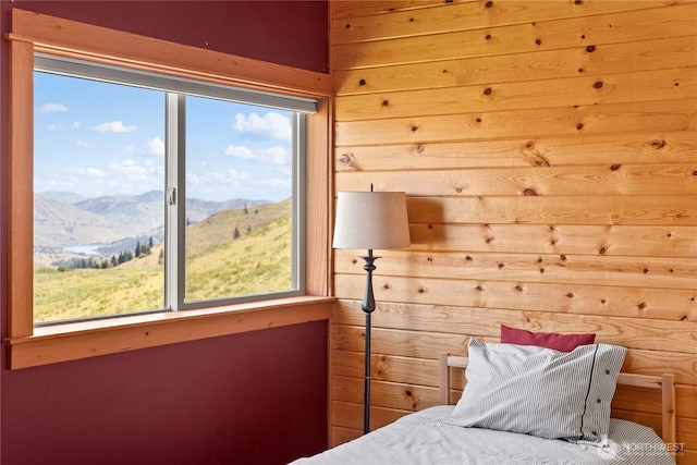 427 Rendezvous Rd, Winthrop, WA 98862 - bedroom featuring a mountain view, multiple windows, and wood walls