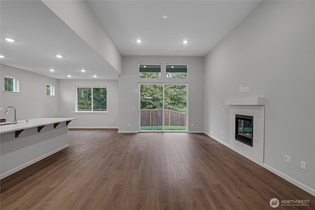 2605 S 7th Way, Ridgefield, WA 98642 - living area with a fireplace, dark wood finished floors, healthy amount of natural light, recessed lighting, and baseboards