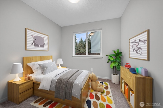2605 S 7th Way, Ridgefield, WA 98642 - bedroom with baseboards, carpet flooring, and a textured ceiling