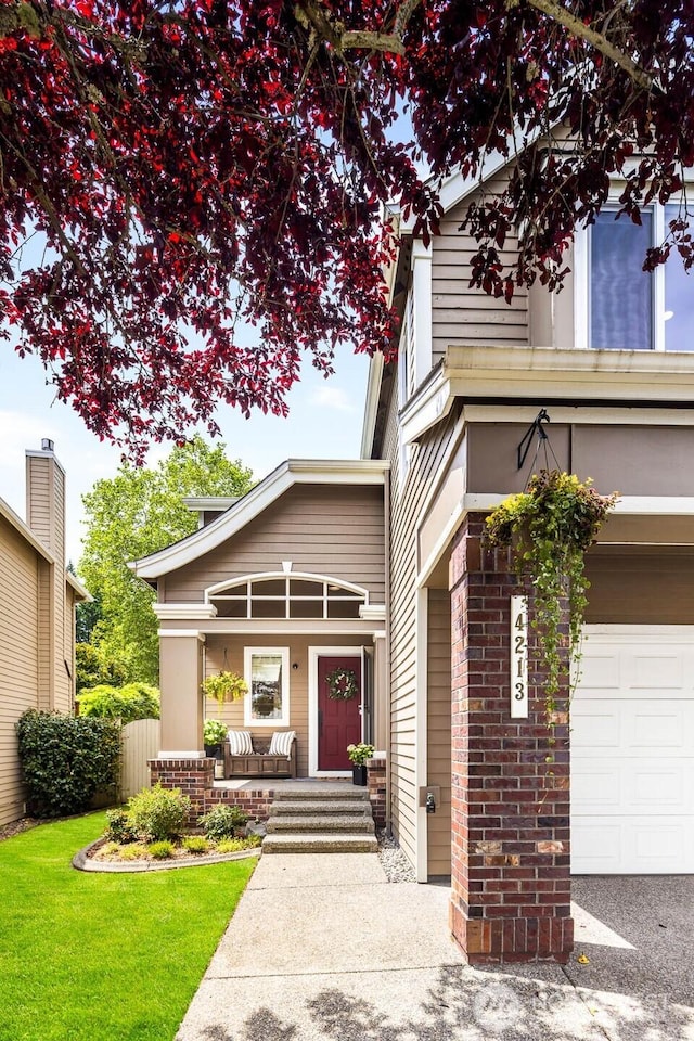 4213 249th Ct SE, Sammamish, WA 98029 - view of front of house with a porch, an attached garage, brick siding, and a front yard