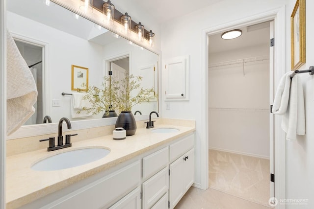 4213 249th Ct SE, Sammamish, WA 98029 - bathroom with double vanity, a walk in closet, and tile patterned flooring