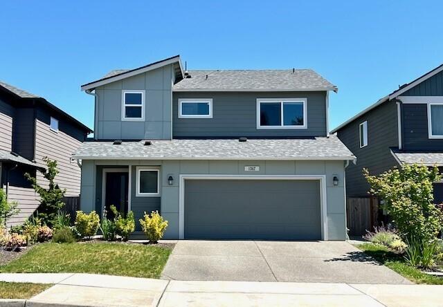 1342 Cascade St, Sultan, WA 98294 - view of front of property with an attached garage, a shingled roof, and driveway