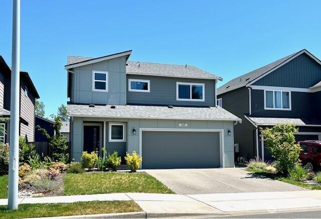 1342 Cascade St, Sultan, WA 98294 - view of front of property with an attached garage, driveway, and a shingled roof