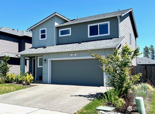 1342 Cascade St, Sultan, WA 98294 - view of front of property with an attached garage, roof with shingles, and concrete driveway