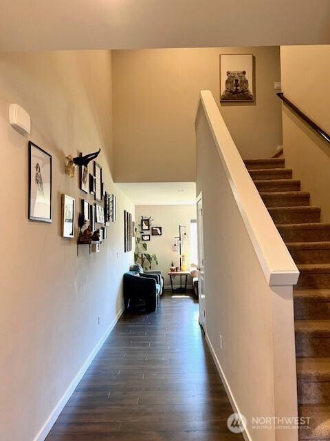 1342 Cascade St, Sultan, WA 98294 - corridor featuring dark wood-style flooring, baseboards, and stairway
