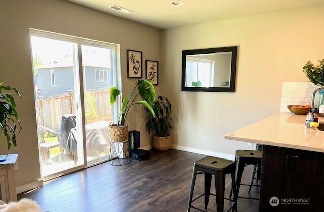 1342 Cascade St, Sultan, WA 98294 - dining area with dark wood-style flooring and baseboards
