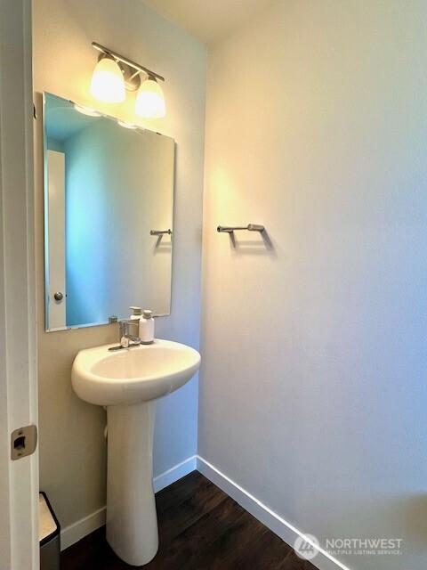 1342 Cascade St, Sultan, WA 98294 - bathroom with baseboards, wood finished floors, and a sink