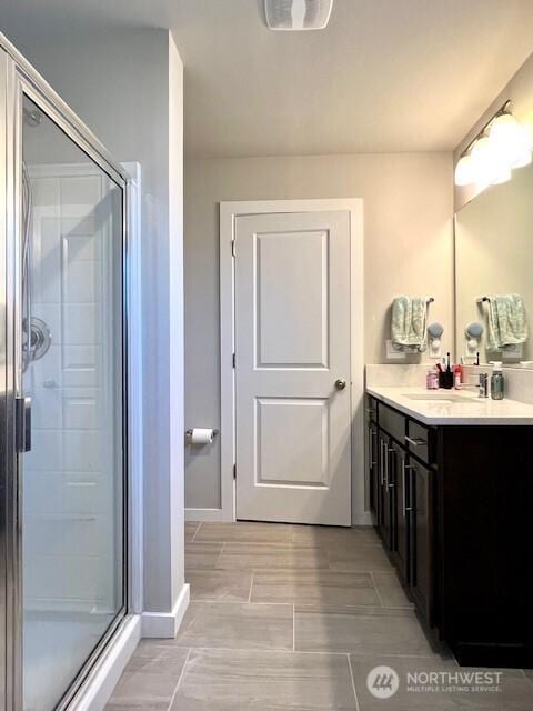 1342 Cascade St, Sultan, WA 98294 - bathroom featuring vanity, a shower stall, and baseboards