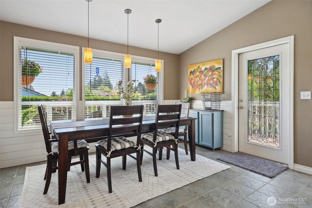 1910 Lenox Ct NW, Olympia, WA 98502 - dining area featuring healthy amount of natural light, vaulted ceiling, and stone finish flooring