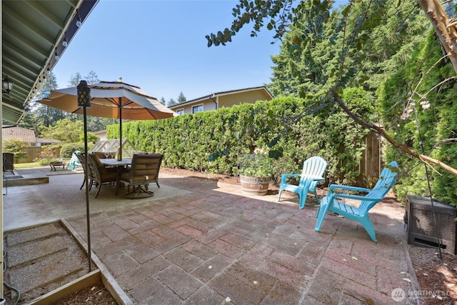 1910 Lenox Ct NW, Olympia, WA 98502 - fenced backyard with a patio area and outdoor dining area