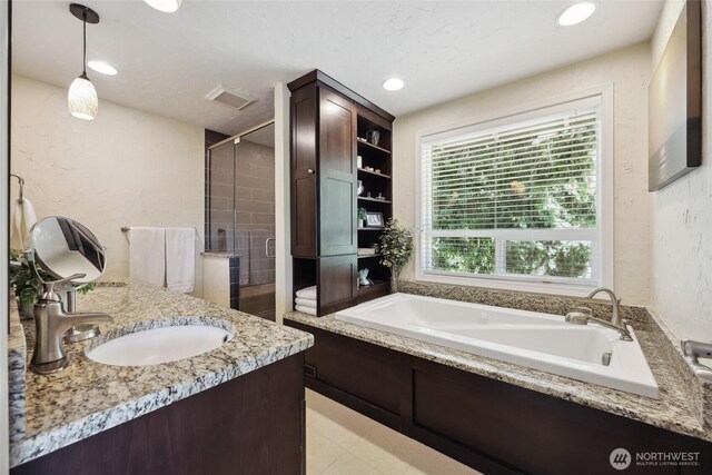 1910 Lenox Ct NW, Olympia, WA 98502 - bathroom featuring a stall shower, a garden tub, vanity, a textured wall, and recessed lighting