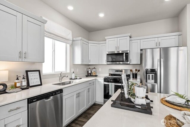 1725 Noble Ave Unit 81, Snohomish, WA 98290 - kitchen with stainless steel appliances, a sink, light countertops, recessed lighting, and dark wood-type flooring