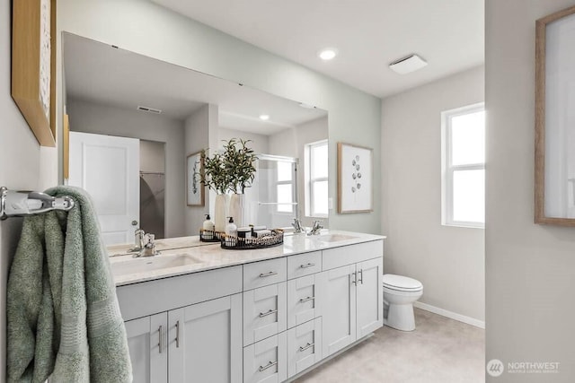 1725 Noble Ave Unit 81, Snohomish, WA 98290 - bathroom with double vanity, baseboards, toilet, a shower with shower door, and recessed lighting