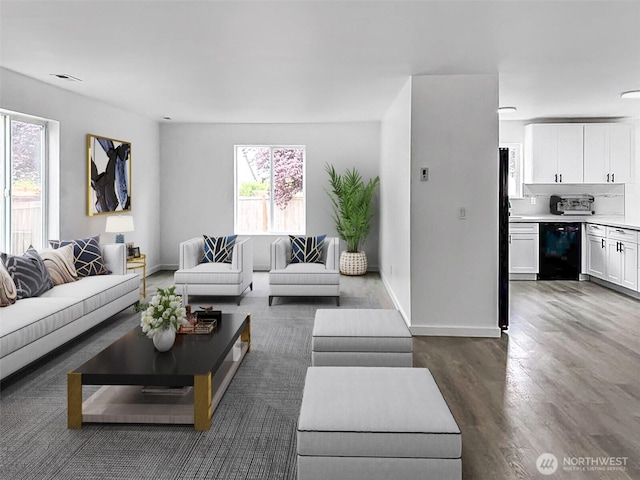 20112 14th Avenue Ct E, Spanaway, WA 98387 - living room featuring dark wood-style flooring and baseboards
