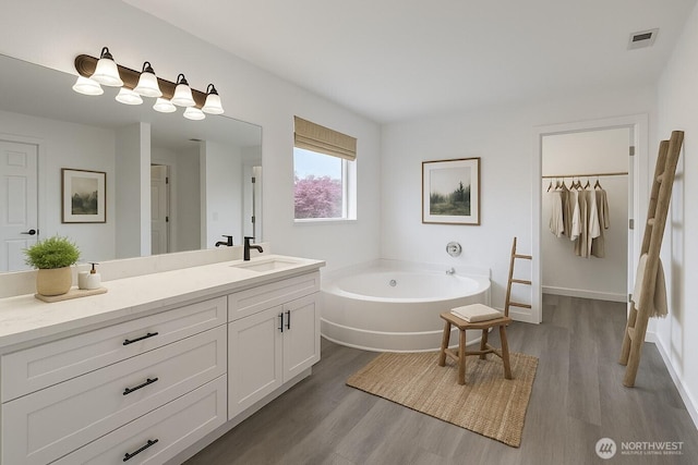20112 14th Avenue Ct E, Spanaway, WA 98387 - full bath with a bath, wood finished floors, and vanity