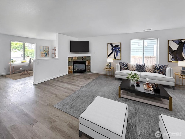 20112 14th Avenue Ct E, Spanaway, WA 98387 - living area featuring wood finished floors and a tile fireplace