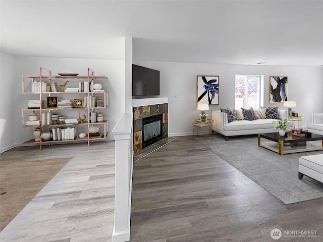 20112 14th Avenue Ct E, Spanaway, WA 98387 - living area featuring wood finished floors and a tiled fireplace