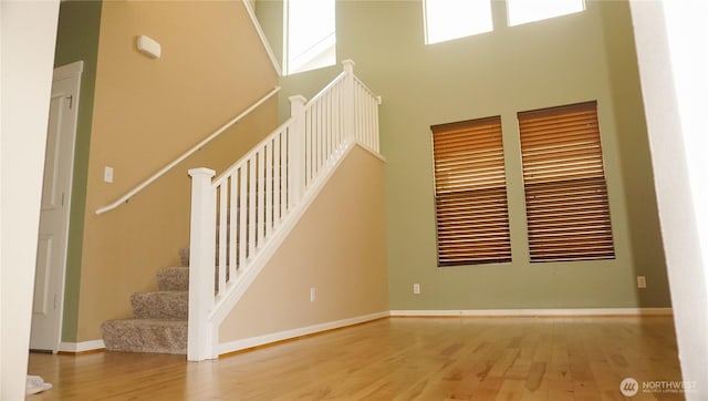 21502 51st Ave S Unit 44, Kent, WA 98032 - stairway with wood finished floors and a high ceiling