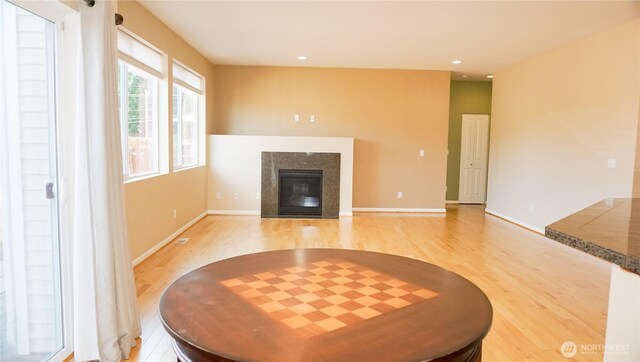 21502 51st Ave S Unit 44, Kent, WA 98032 - living room with light wood-style flooring, a fireplace, and recessed lighting
