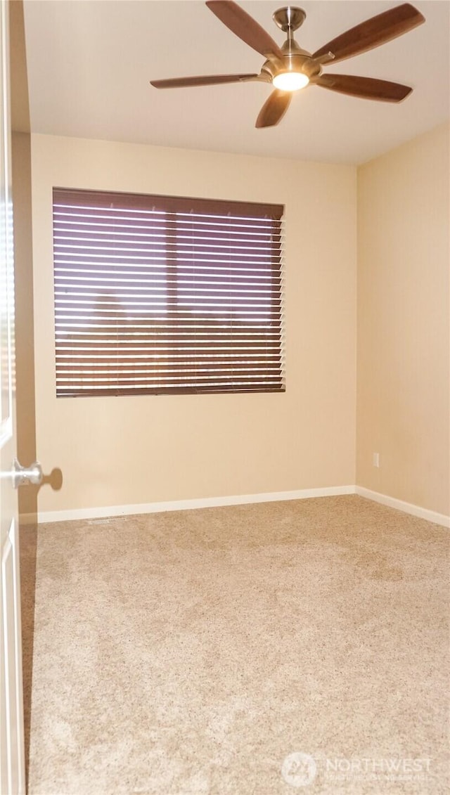 21502 51st Ave S Unit 44, Kent, WA 98032 - carpeted empty room with a ceiling fan and baseboards