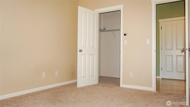 21502 51st Ave S Unit 44, Kent, WA 98032 - unfurnished bedroom featuring carpet flooring and a closet