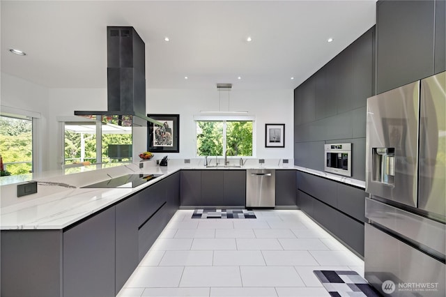 63 Red Cedar Ln, Port Ludlow, WA 98365 - kitchen featuring stainless steel appliances, modern cabinets, island range hood, light stone countertops, and recessed lighting
