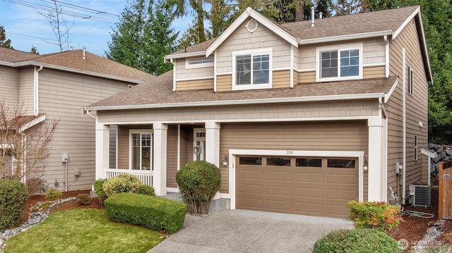 22811 36th Dr SE, Bothell, WA 98021 - view of front facade with a garage, covered porch, concrete driveway, and a shingled roof