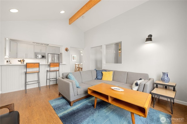244 N Emerson Ave, Wenatchee, WA 98801 - living area with beam ceiling, light wood finished floors, and high vaulted ceiling