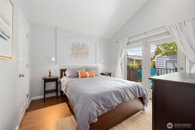 244 N Emerson Ave, Wenatchee, WA 98801 - bedroom with access to exterior, light wood-type flooring, and high vaulted ceiling