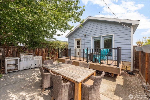 244 N Emerson Ave, Wenatchee, WA 98801 - rear view of house with a deck, a fenced backyard, outdoor dining space, and a patio area