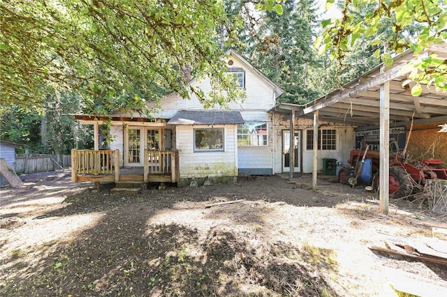 7029 Riverview Rd, Snohomish, WA 98290 - back of house with a deck, a carport, and french doors