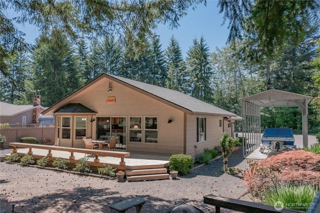180N Mount Christie Dr, Hoodsport, WA 98548 - view of front facade featuring a wooden deck, a carport, and roof with shingles