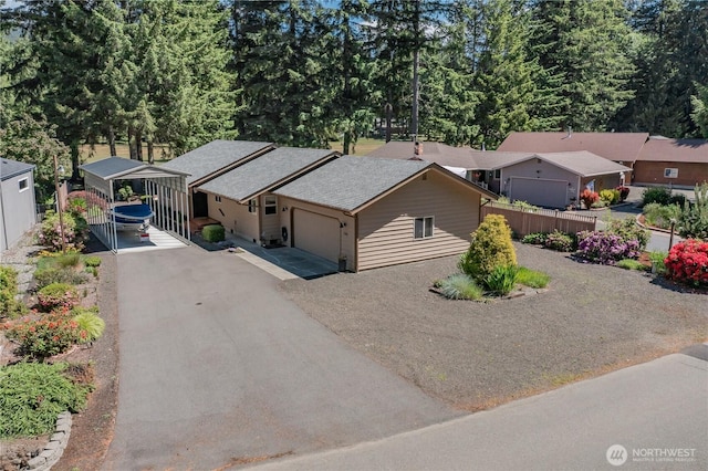180N Mount Christie Dr, Hoodsport, WA 98548 - view of front facade featuring a garage, a carport, and asphalt driveway
