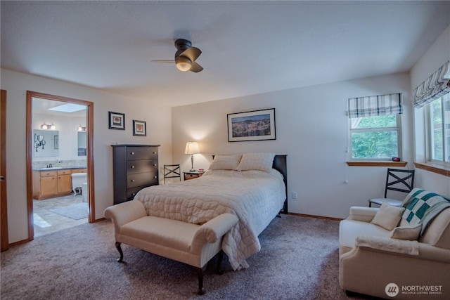 180N Mount Christie Dr, Hoodsport, WA 98548 - bedroom with light carpet, connected bathroom, baseboards, and a ceiling fan