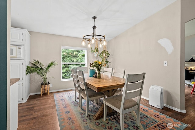 10455 Woodchuck Ln SE, Port Orchard, WA 98367 - dining room with dark wood finished floors, a chandelier, and arched walkways