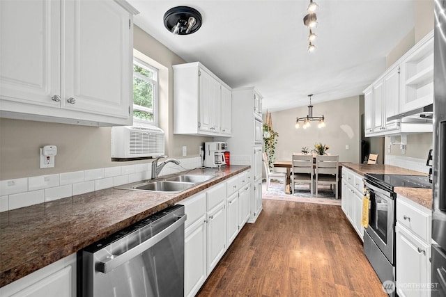 10455 Woodchuck Ln SE, Port Orchard, WA 98367 - kitchen with appliances with stainless steel finishes, white cabinetry, dark wood-style flooring, a chandelier, and open shelves