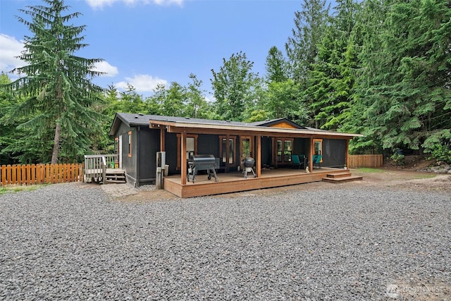 10455 Woodchuck Ln SE, Port Orchard, WA 98367 - rear view of house featuring french doors and a deck