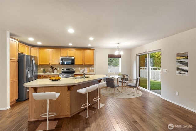 3632 London Loop NE, Lacey, WA 98516 - kitchen featuring stainless steel appliances, light countertops, dark wood-type flooring, recessed lighting, and backsplash