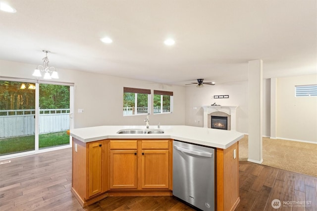 3632 London Loop NE, Lacey, WA 98516 - kitchen with stainless steel dishwasher, dark wood-type flooring, light countertops, open floor plan, and recessed lighting