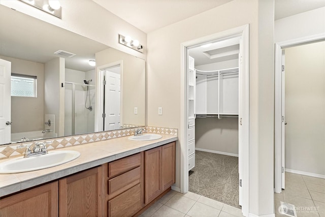 3632 London Loop NE, Lacey, WA 98516 - full bathroom with a stall shower, double vanity, tile patterned flooring, a walk in closet, and a tub
