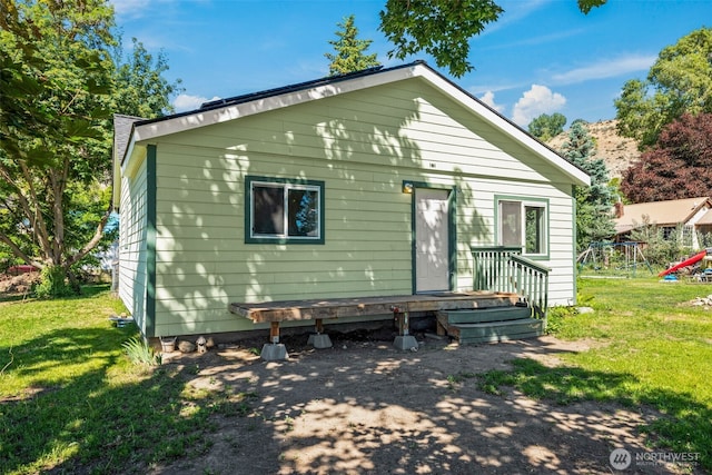 101 N Elm St N, Omak, WA 98841 - back of house featuring a yard and a playground