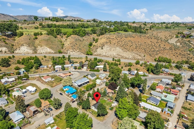 101 N Elm St N, Omak, WA 98841 - aerial view of property's location featuring a mountain backdrop