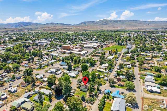 101 N Elm St N, Omak, WA 98841 - aerial perspective of suburban area featuring a mountainous background