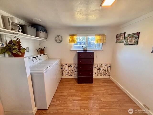 545 Hendricks St Unit 33, Port Townsend, WA 98368 - laundry room with washer and dryer and light wood-type flooring
