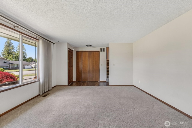1001 Garden Dr, Lynden, WA 98264 - empty room featuring carpet flooring and a textured ceiling