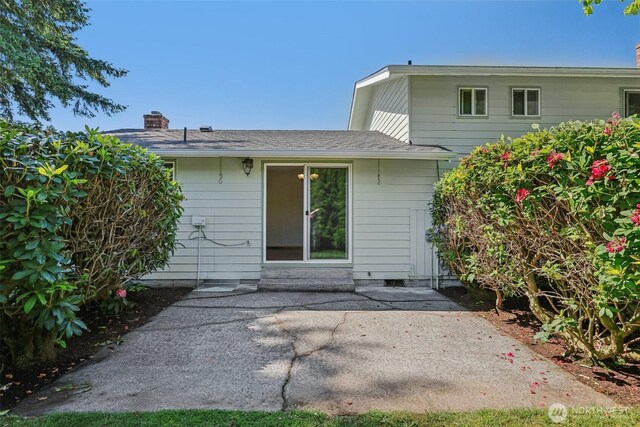 1001 Garden Dr, Lynden, WA 98264 - rear view of property featuring a chimney and a patio area