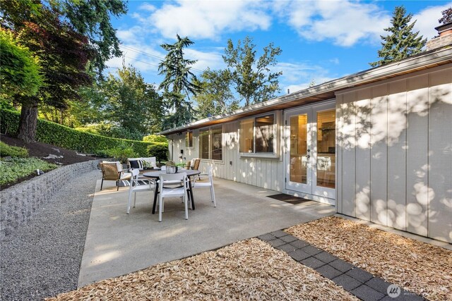 7979 NE 28th St, Medina, WA 98039 - view of patio / terrace with outdoor dining space and french doors