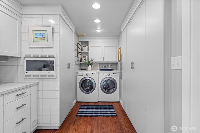 7979 NE 28th St, Medina, WA 98039 - laundry room featuring independent washer and dryer, cabinet space, dark wood-style floors, and recessed lighting