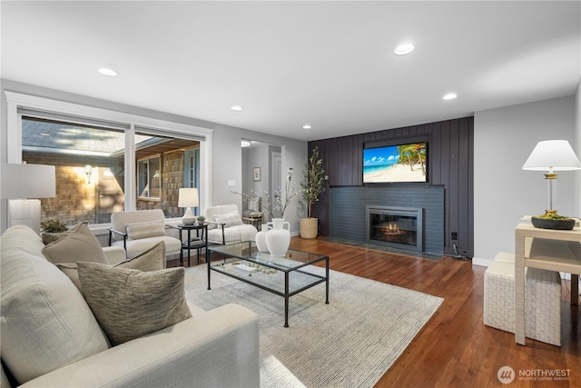 7979 NE 28th St, Medina, WA 98039 - living room featuring a fireplace with flush hearth, wood finished floors, and recessed lighting